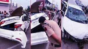 Speeding car crashes into divider, lands on another car; video goes viral