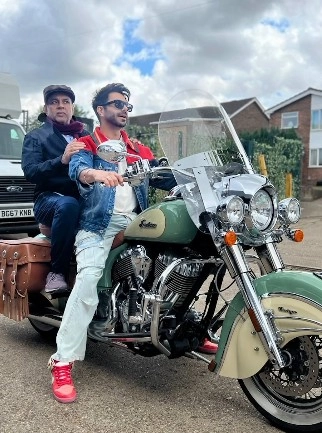 Aparshakti Khurana Rides Bike with Paresh Rawal Behind